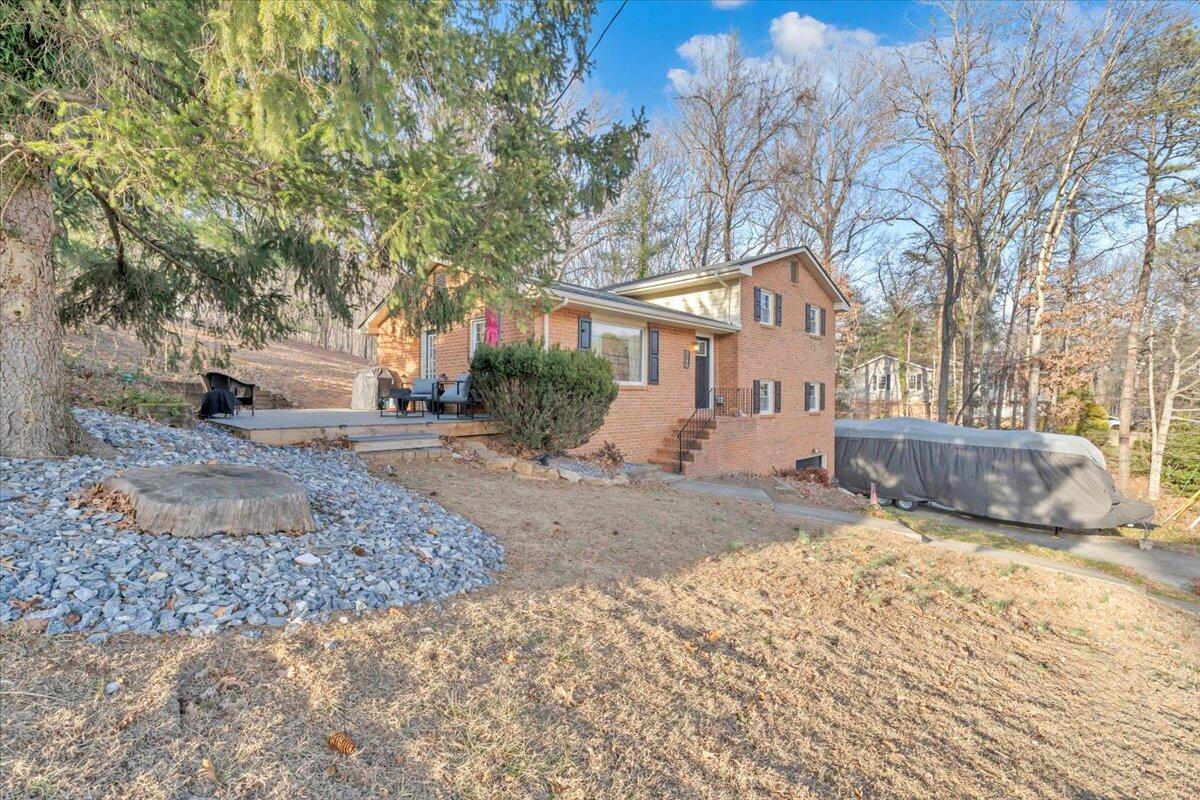 2166 Ruritan Road Roanoke, VA 24012 - Photo 46 of 46 a view of a house with a yard covered in snow
