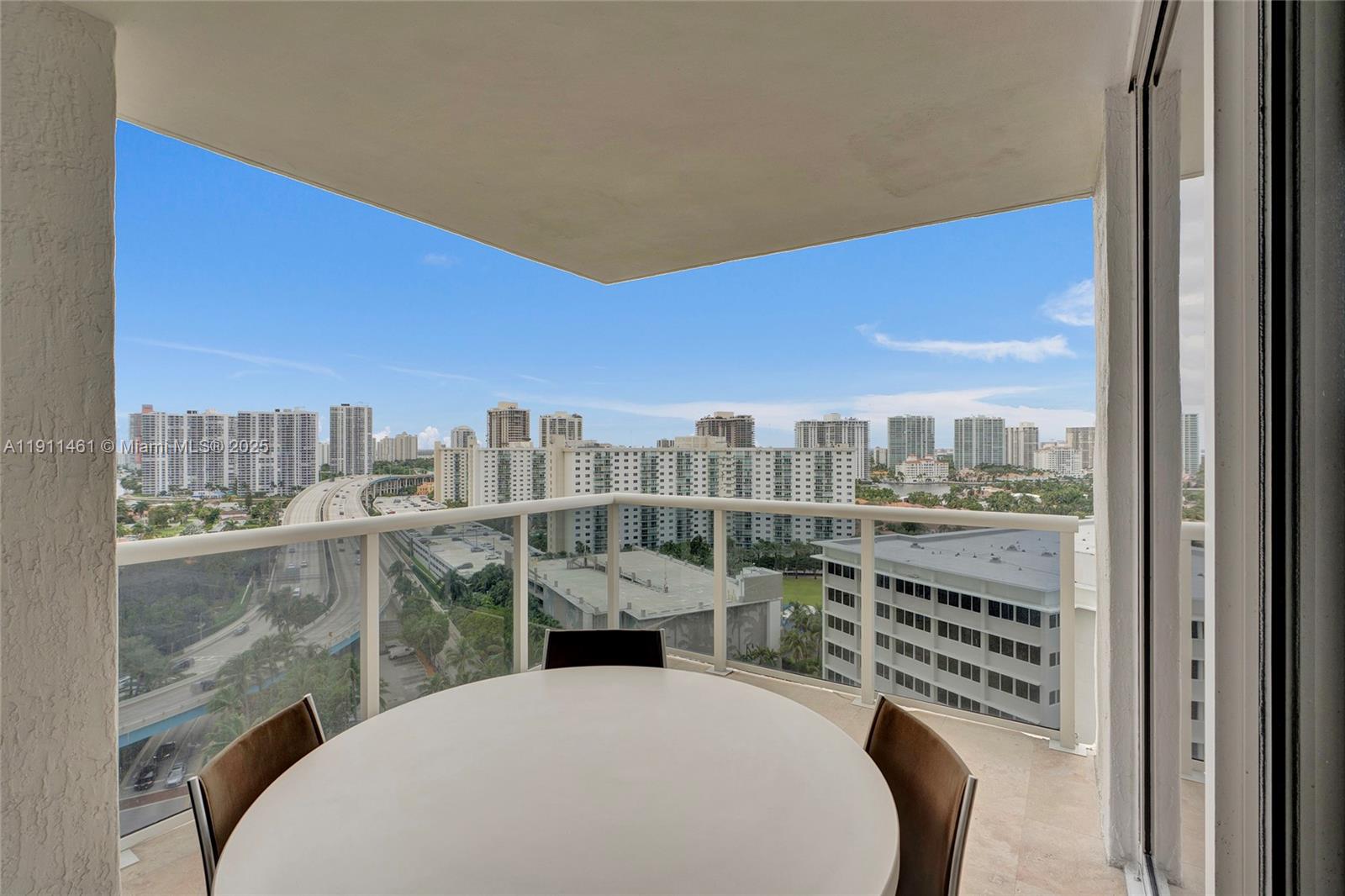 19111 Collins Avenue, Unit 1602 Sunny Isles Beach, FL 33160 - Photo 26 of 93 a view of a city from a balcony