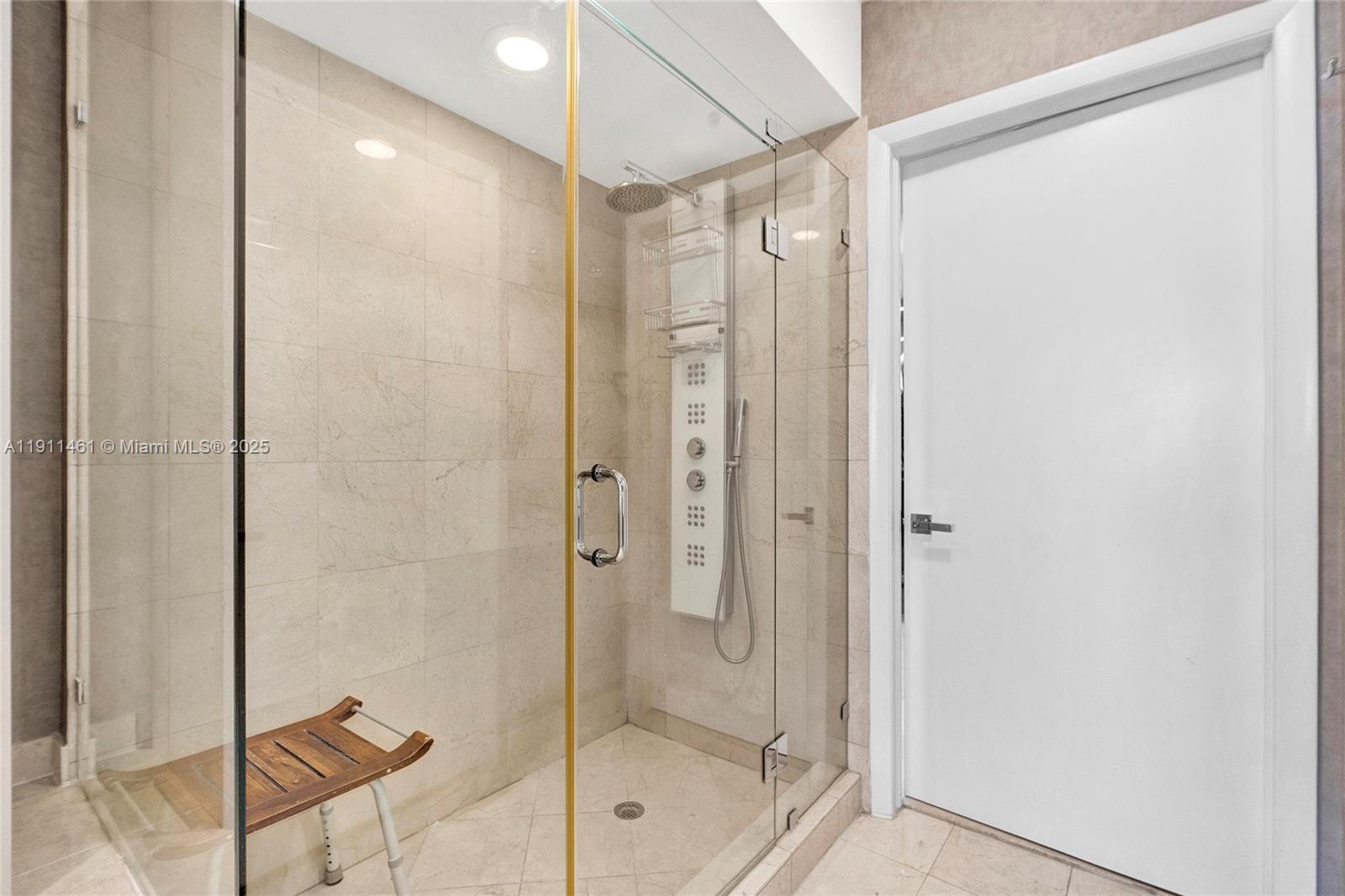 19111 Collins Avenue, Unit 1602 Sunny Isles Beach, FL 33160 - Photo 39 of 93 a bathroom with a shower and a sink
