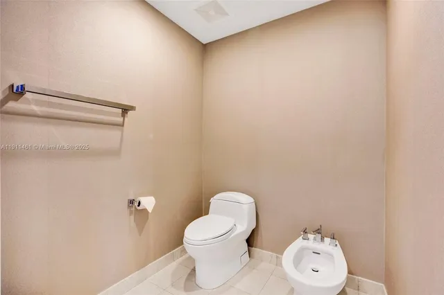 a living room with furniture a table and a large window