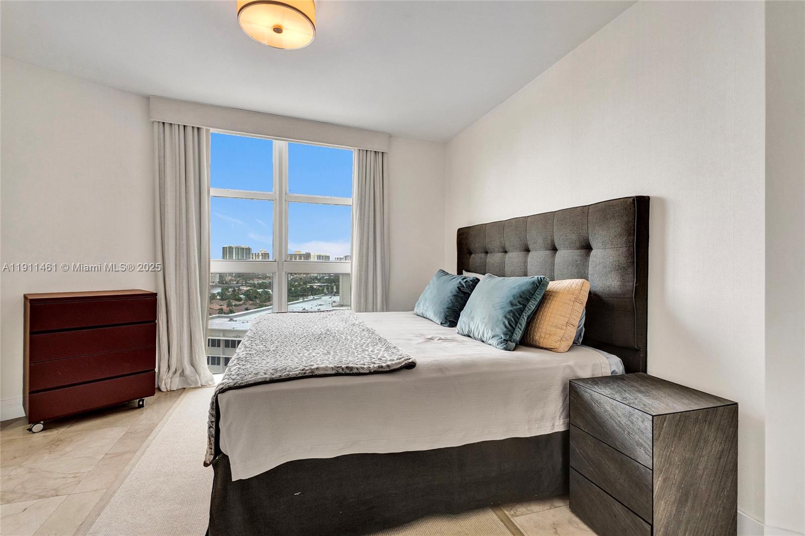 19111 Collins Avenue, Unit 1602 Sunny Isles Beach, FL 33160 - Photo 46 of 93 a bedroom with a bed and window