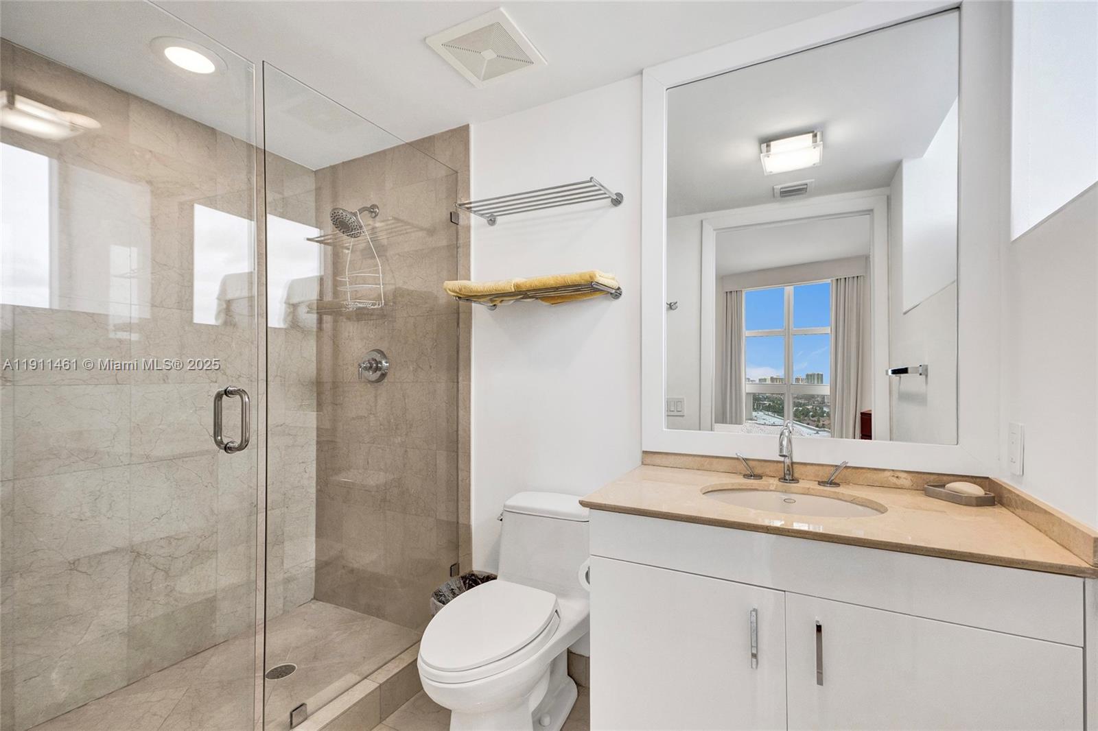 19111 Collins Avenue, Unit 1602 Sunny Isles Beach, FL 33160 - Photo 49 of 93 a bathroom with a granite countertop sink toilet and shower