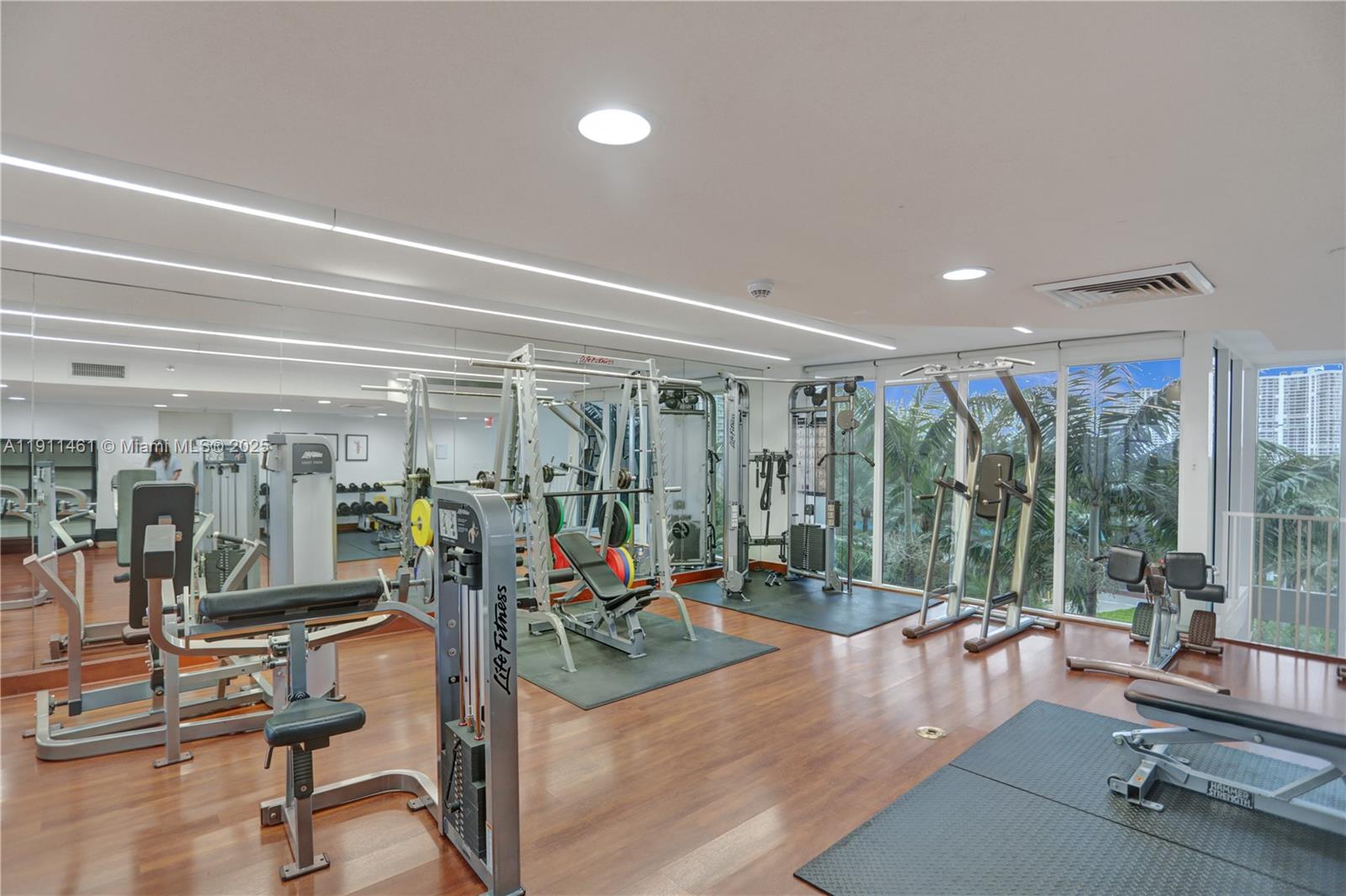 19111 Collins Avenue, Unit 1602 Sunny Isles Beach, FL 33160 - Photo 72 of 93 a view of a room with gym equipment