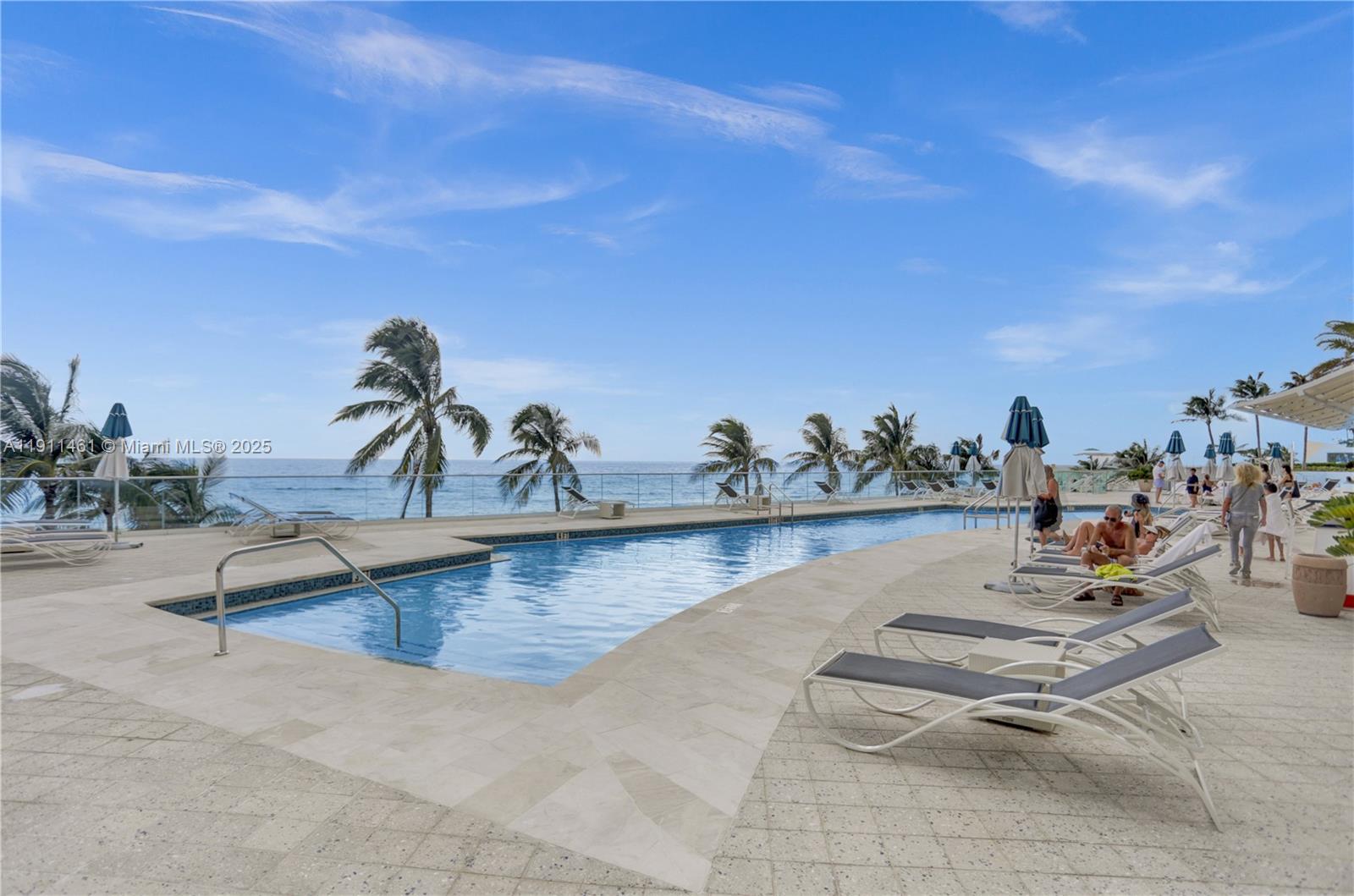 19111 Collins Avenue, Unit 1602 Sunny Isles Beach, FL 33160 - Photo 78 of 93 a view of a swimming pool and lounge chair