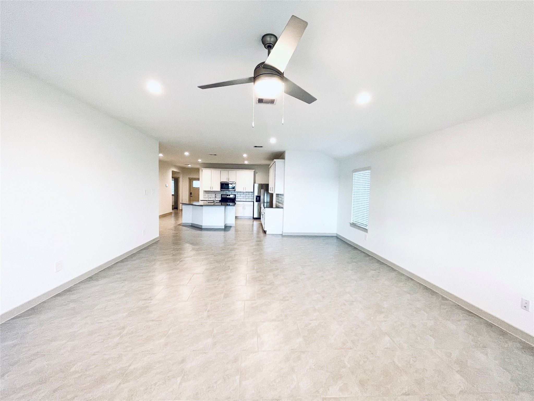 28935 Yachting Point Lane Katy, TX 77494 - Photo 12 of 38 a view of a livingroom with a kitchen counter space and a window