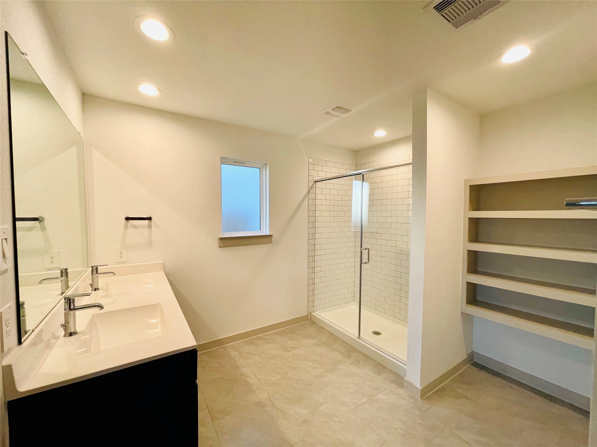 28935 Yachting Point Lane Katy, TX 77494 - Photo 26 of 38 a bathroom with a sink a mirror and a shower