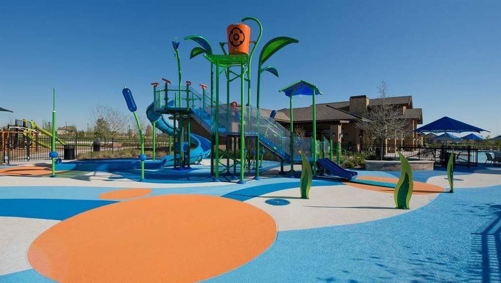 28935 Yachting Point Lane Katy, TX 77494 - Photo 36 of 38 a view of a swimming pool with a bench and lawn chairs