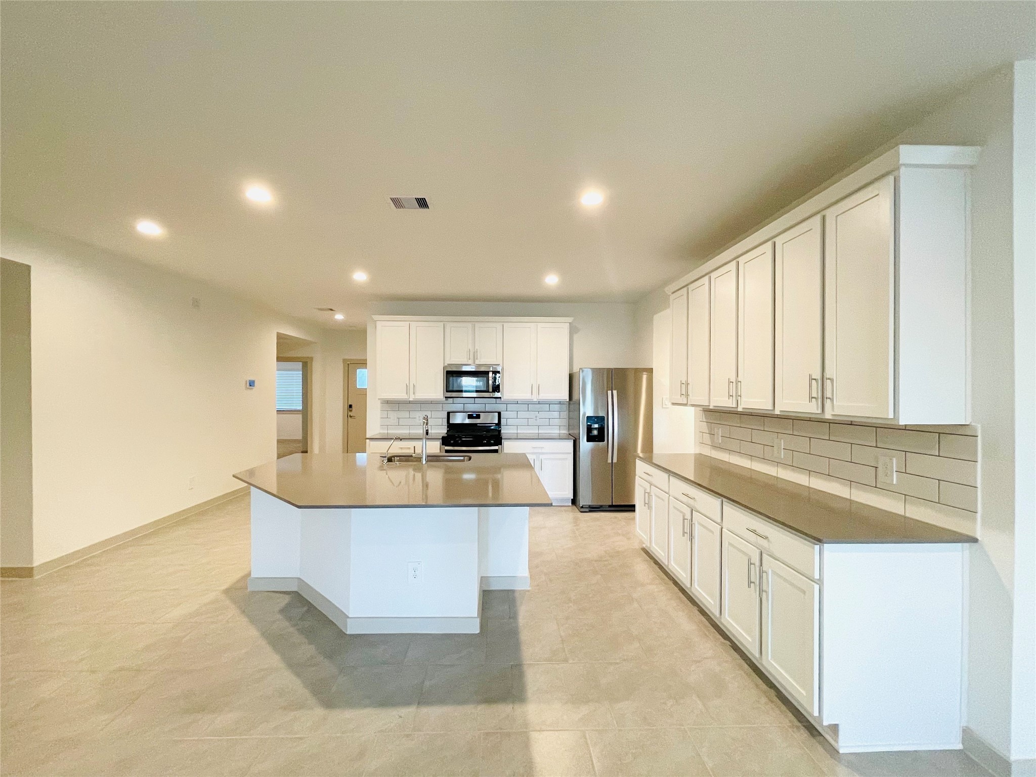 28935 Yachting Point Lane Katy, TX 77494 - Photo 7 of 38 a view of kitchen with kitchen island granite countertop a sink and refrigerator