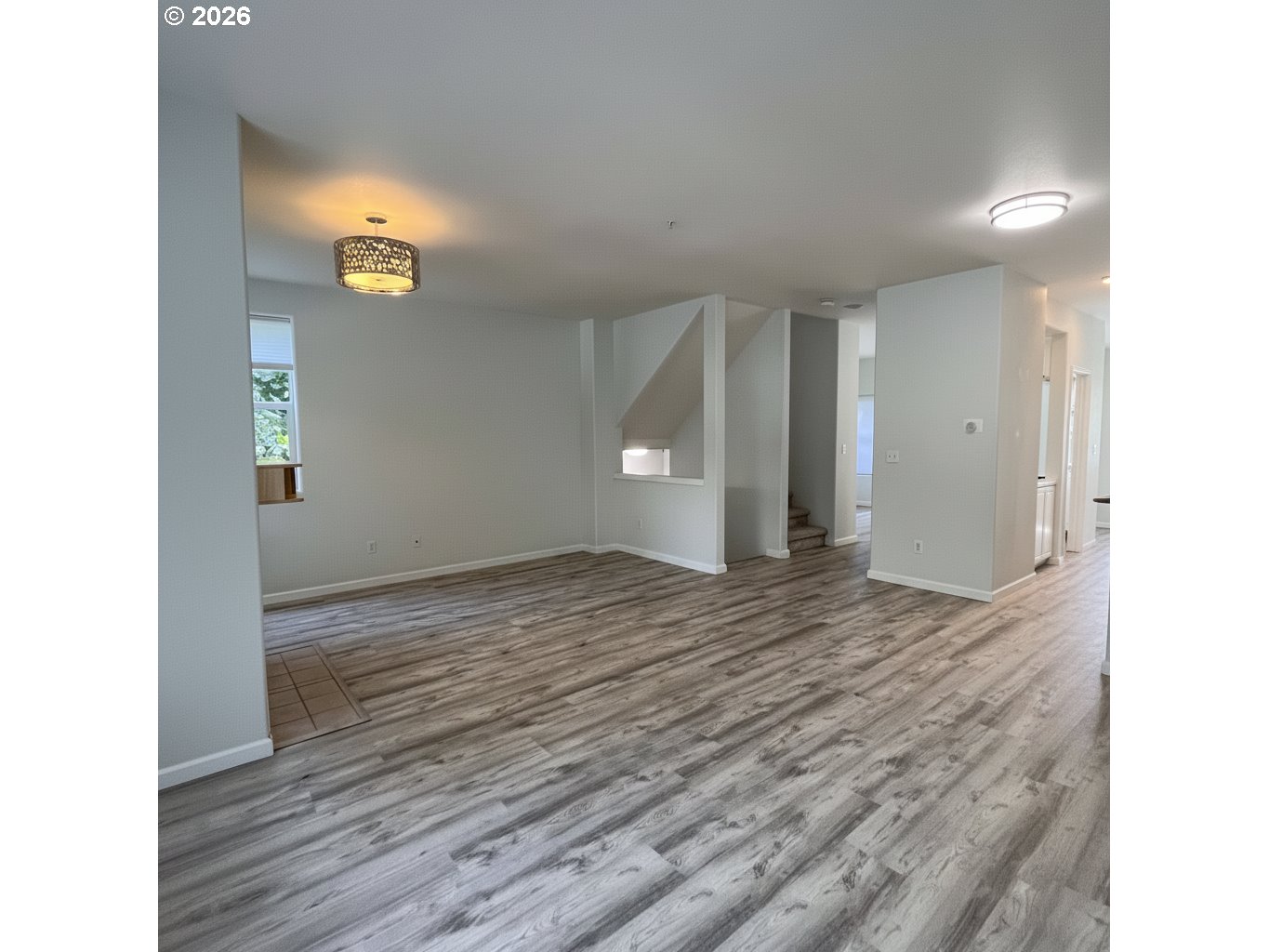 14110 Southwest Barrows Road, Unit 1 Portland, OR 97223 - Photo 9 of 18 a view of empty room with wooden floor