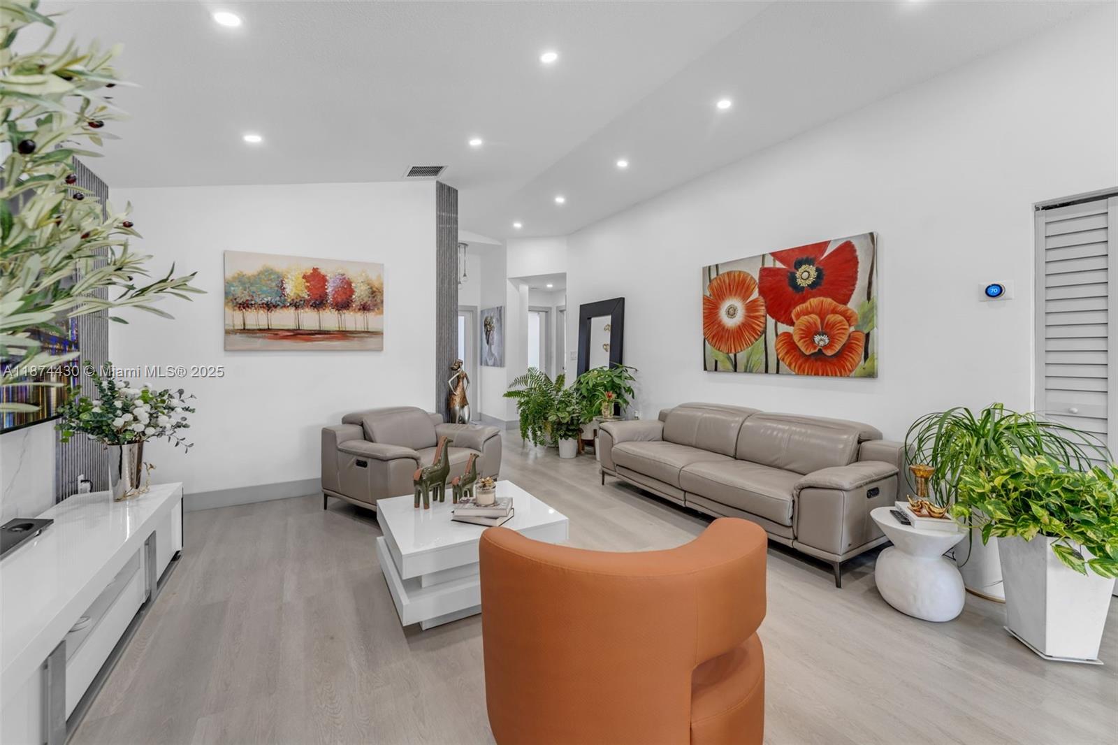16300 Southwest 102nd Street Miami, FL 33196 - Photo 13 of 40 a living room with furniture or couch and a potted plant