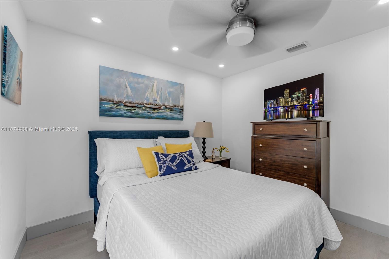 16300 Southwest 102nd Street Miami, FL 33196 - Photo 16 of 40 a bedroom with a bed and a painting on the wall