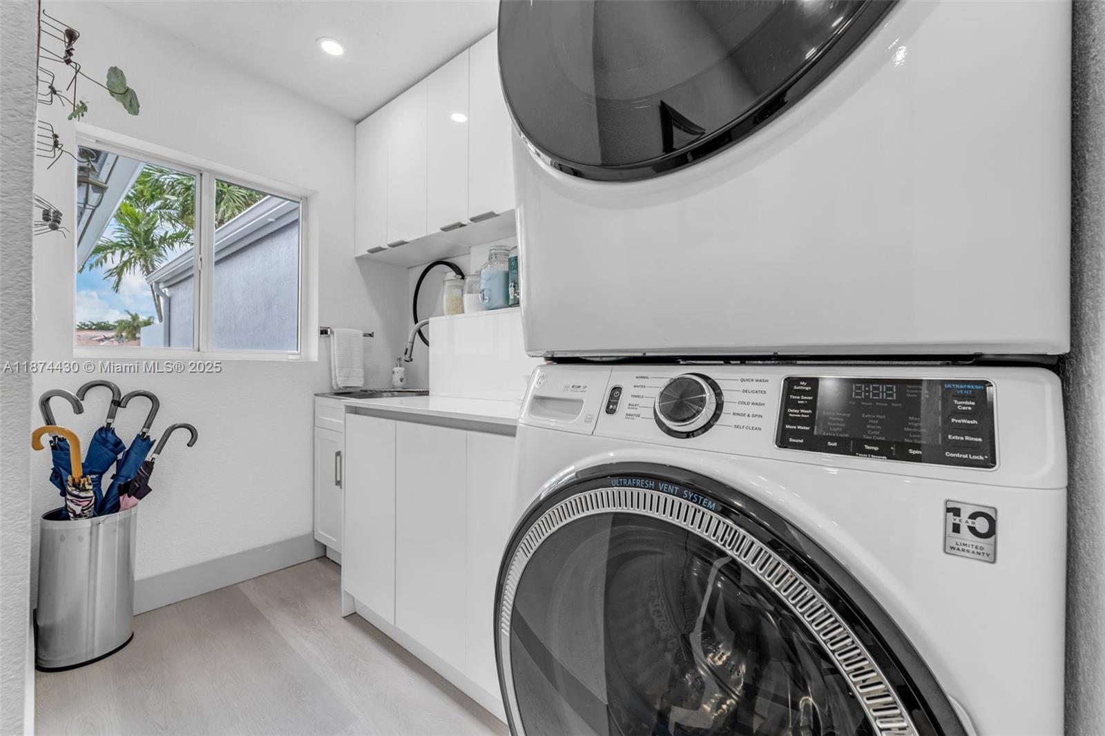 16300 Southwest 102nd Street Miami, FL 33196 - Photo 18 of 40 a utility room with dryer and washer