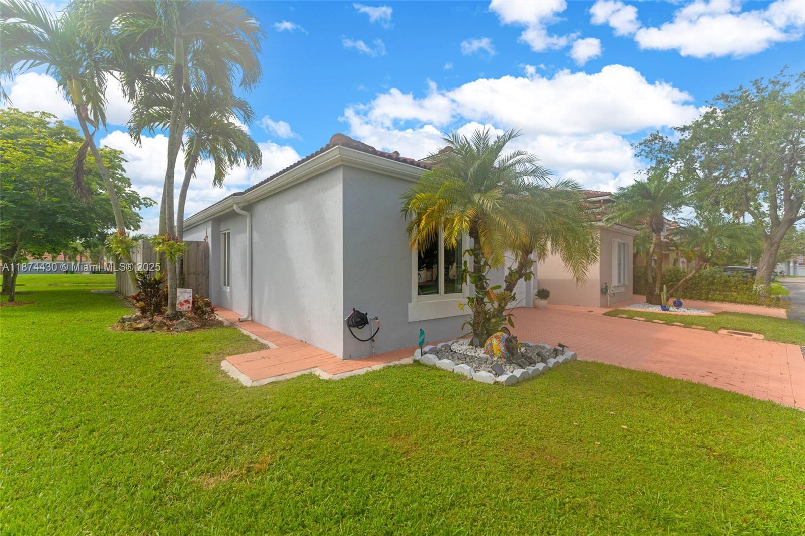 16300 Southwest 102nd Street Miami, FL 33196 - Photo 2 of 40 a view of a house with a yard
