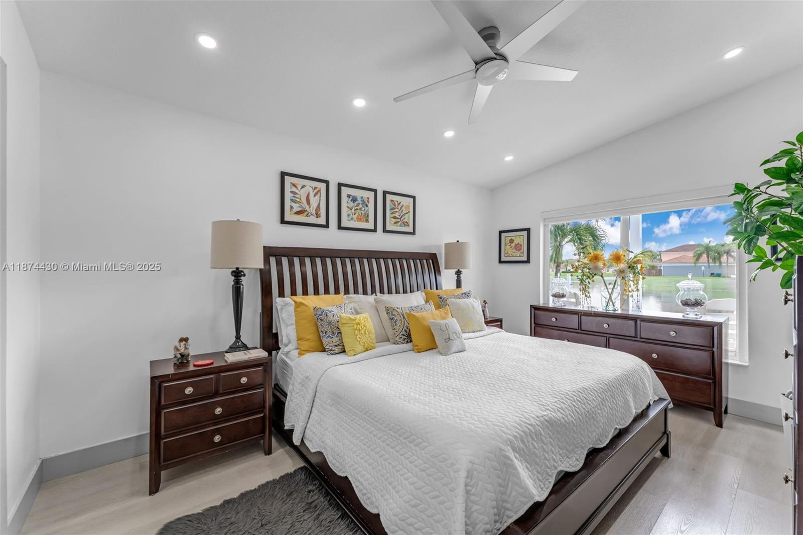 16300 Southwest 102nd Street Miami, FL 33196 - Photo 21 of 40 a bedroom with a bed and a chandelier