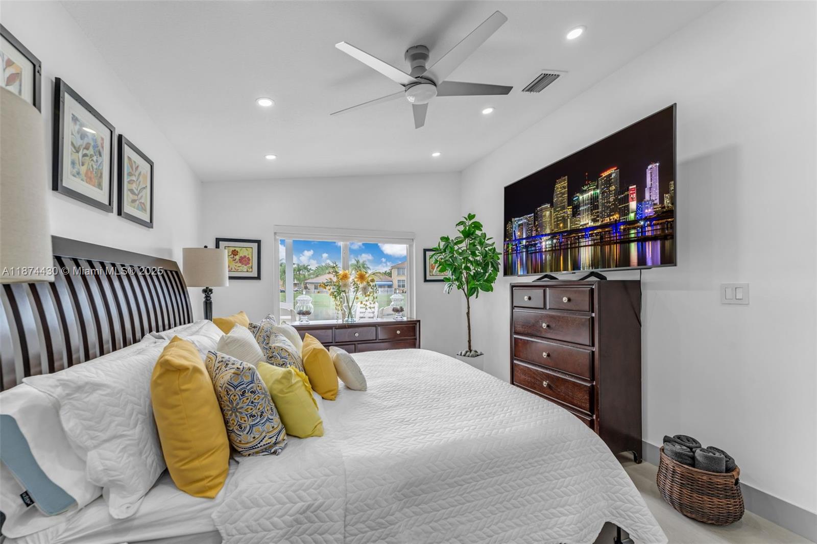 16300 Southwest 102nd Street Miami, FL 33196 - Photo 22 of 40 a bedroom with a bed and a flat screen tv
