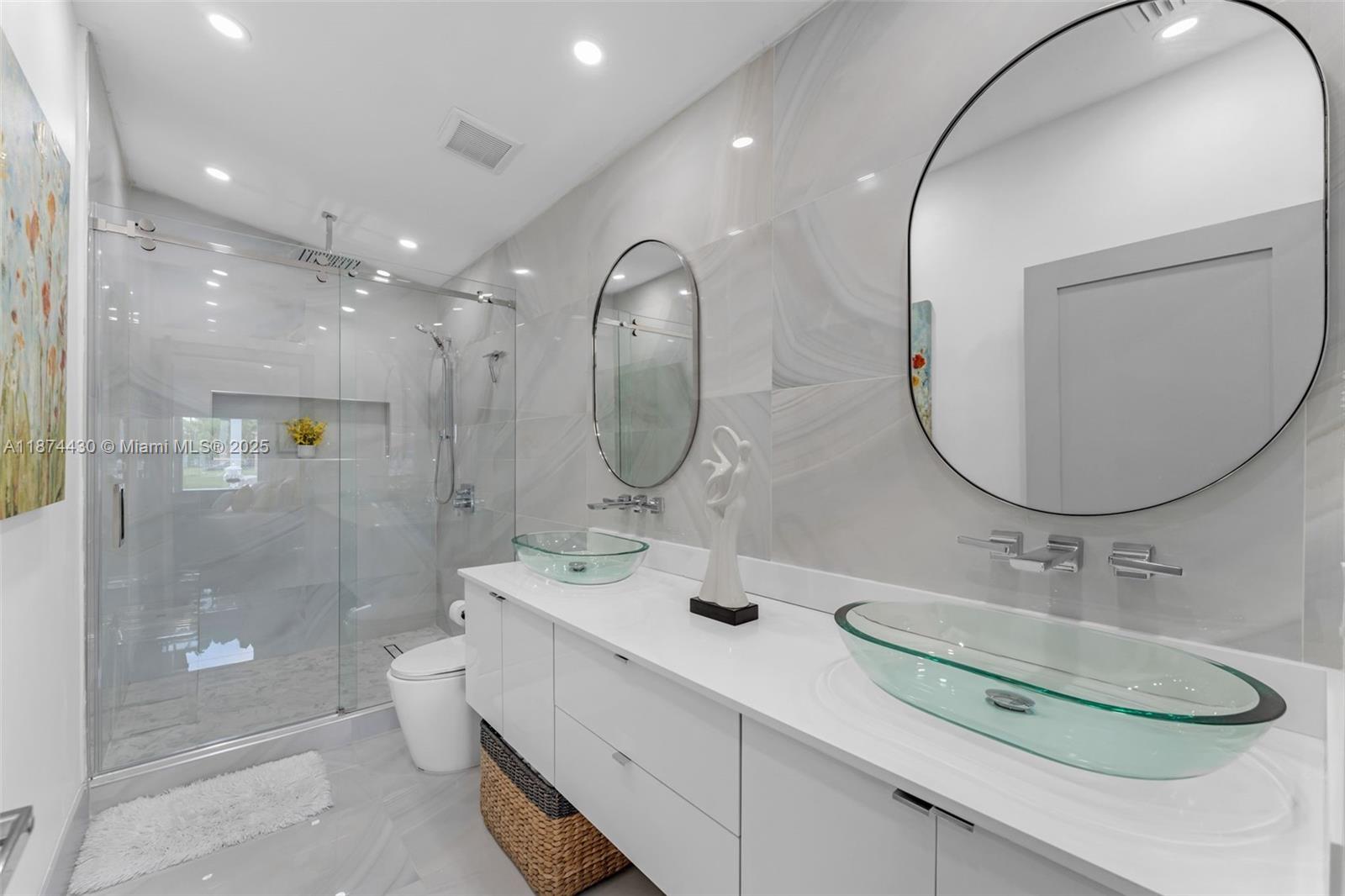 16300 Southwest 102nd Street Miami, FL 33196 - Photo 23 of 40 a bathroom with a double vanity sink mirror and shower