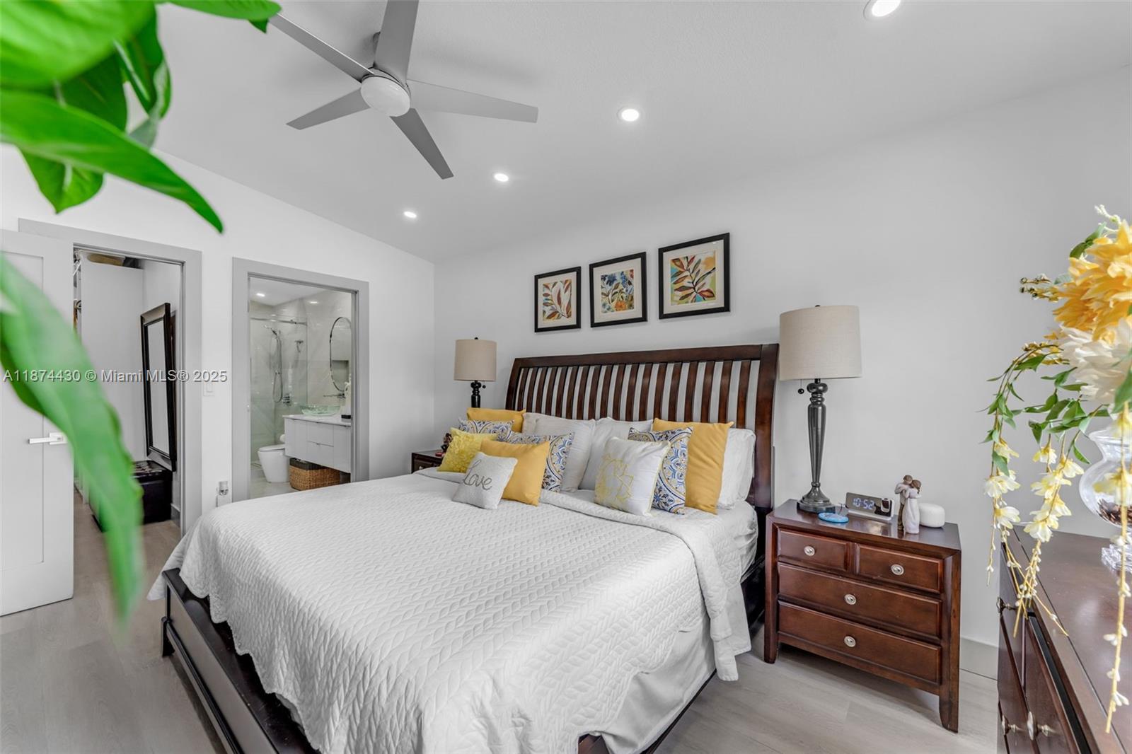 16300 Southwest 102nd Street Miami, FL 33196 - Photo 25 of 40 a bedroom with a bed and a chandelier