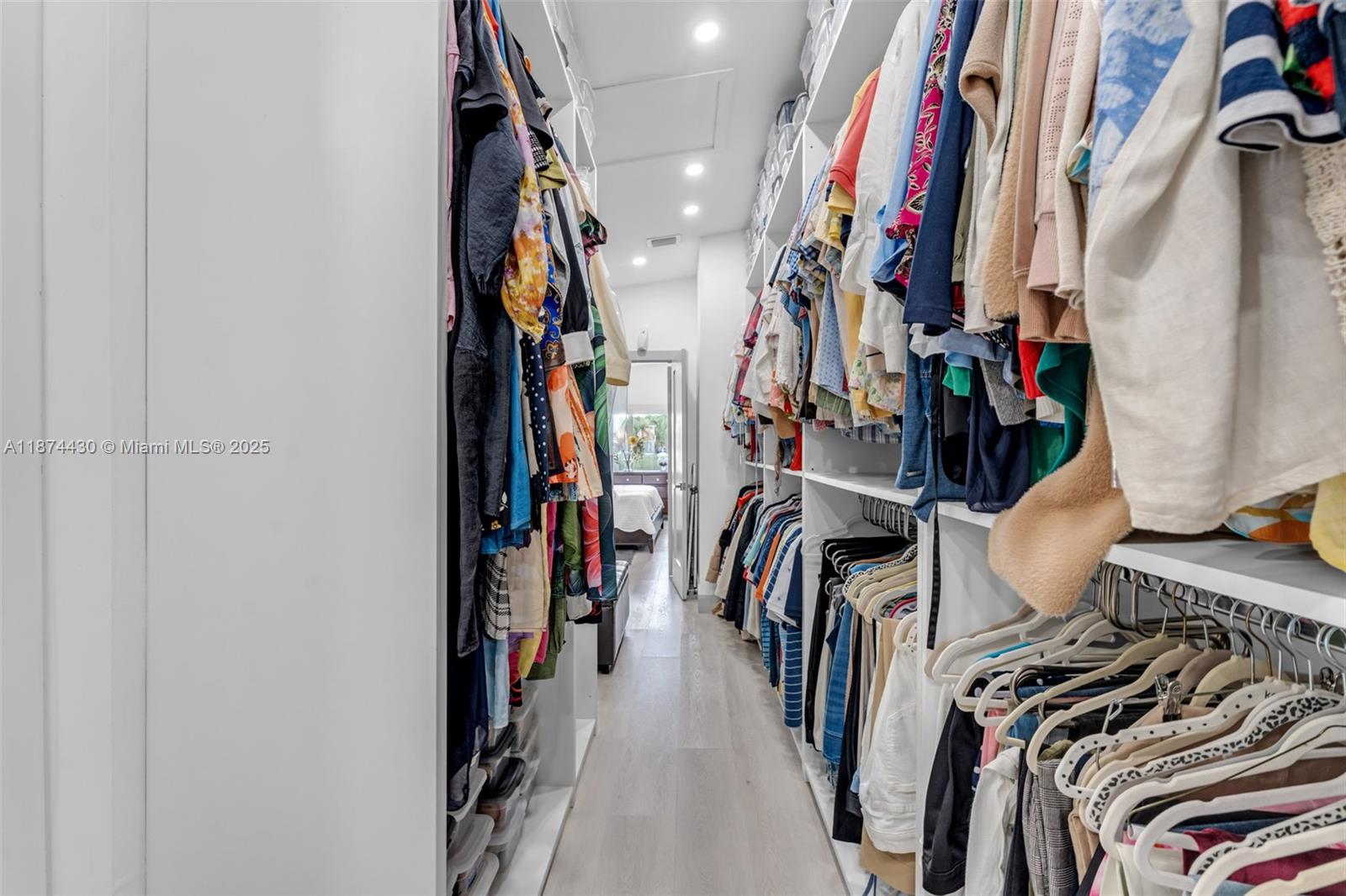 16300 Southwest 102nd Street Miami, FL 33196 - Photo 28 of 40 a view of walk in closet with clothes