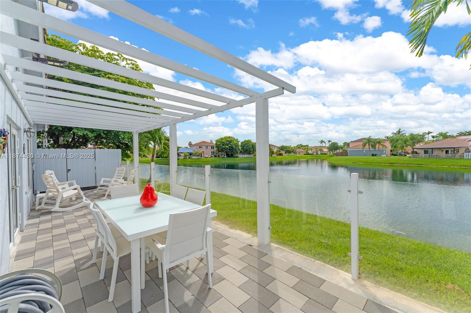 16300 Southwest 102nd Street Miami, FL 33196 - Photo 31 of 40 a view of a table and chairs in the patio
