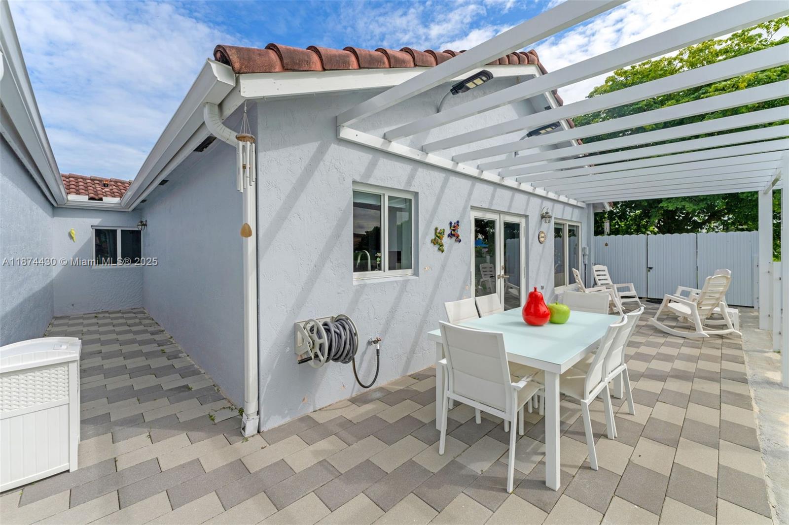 16300 Southwest 102nd Street Miami, FL 33196 - Photo 32 of 40 a view of a patio with table and chairs and potted plants