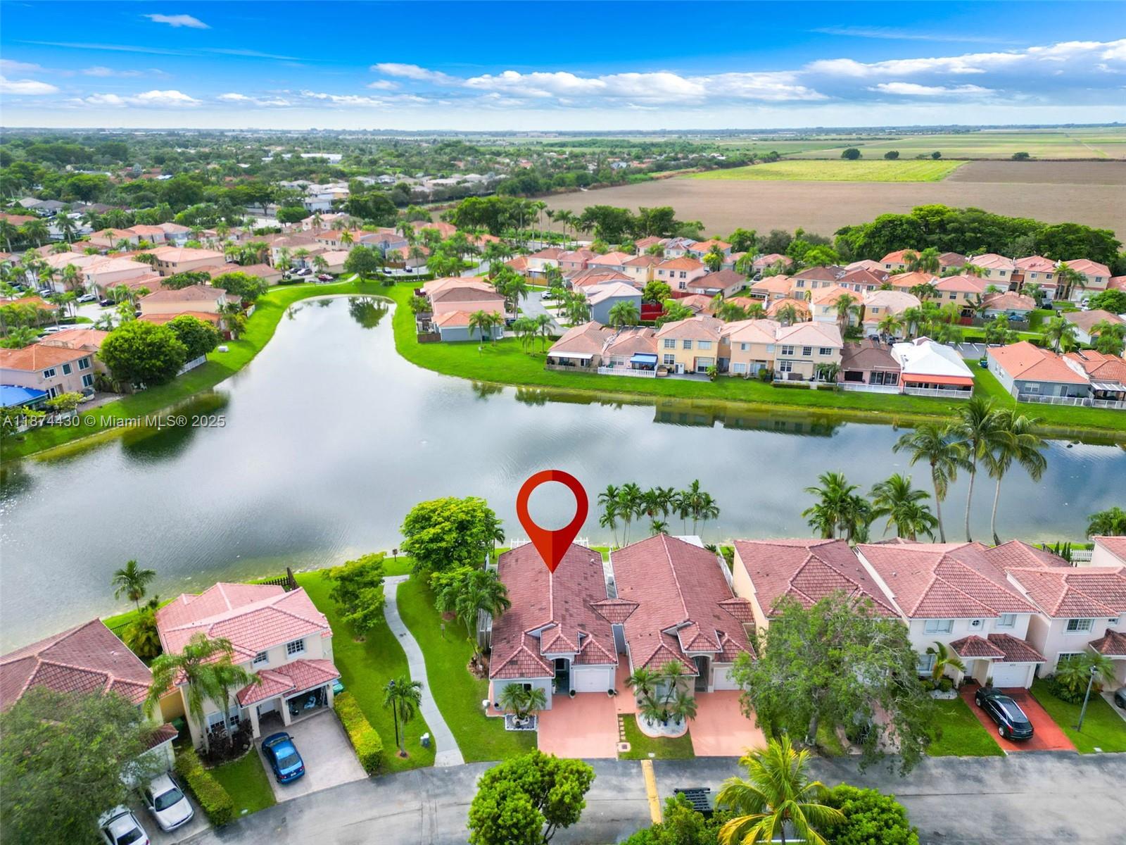 16300 Southwest 102nd Street Miami, FL 33196 - Photo 39 of 40 an aerial view of a city with lots of residential buildings ocean and mountain view in back