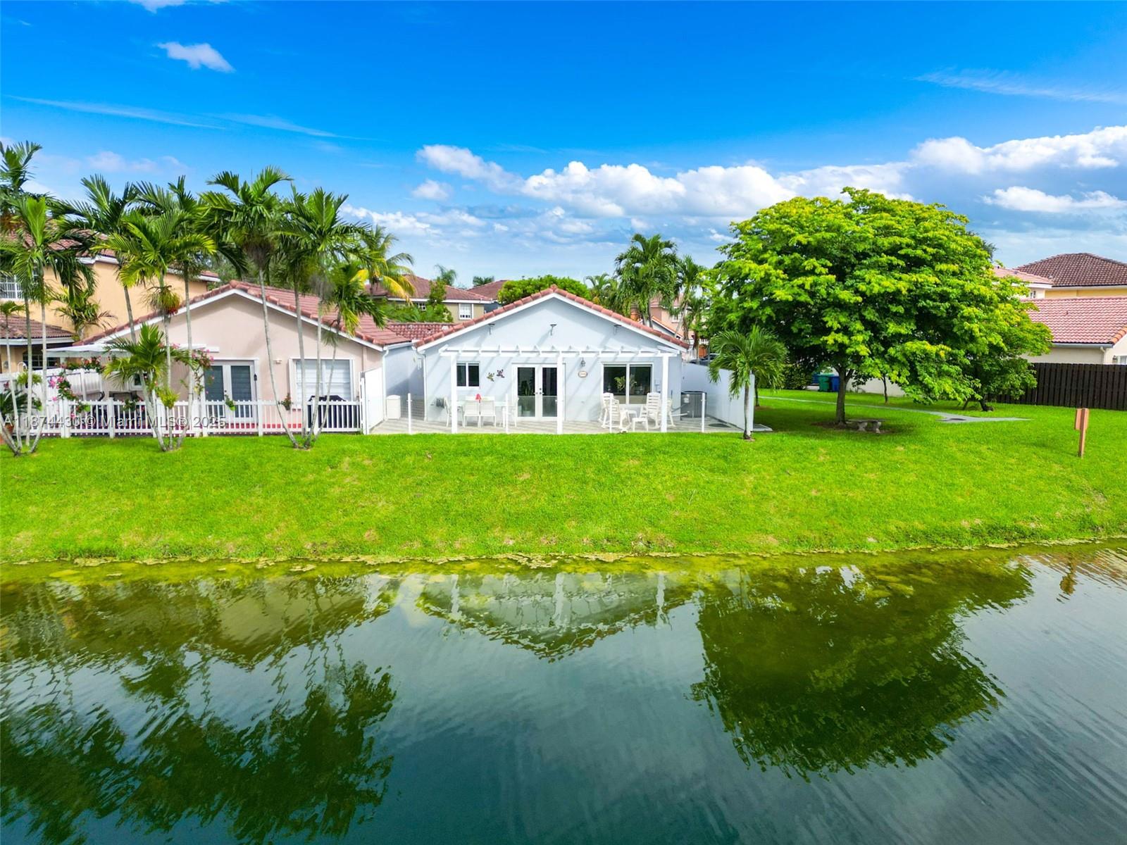 16300 Southwest 102nd Street Miami, FL 33196 - Photo 40 of 40 a house with garden in front of it