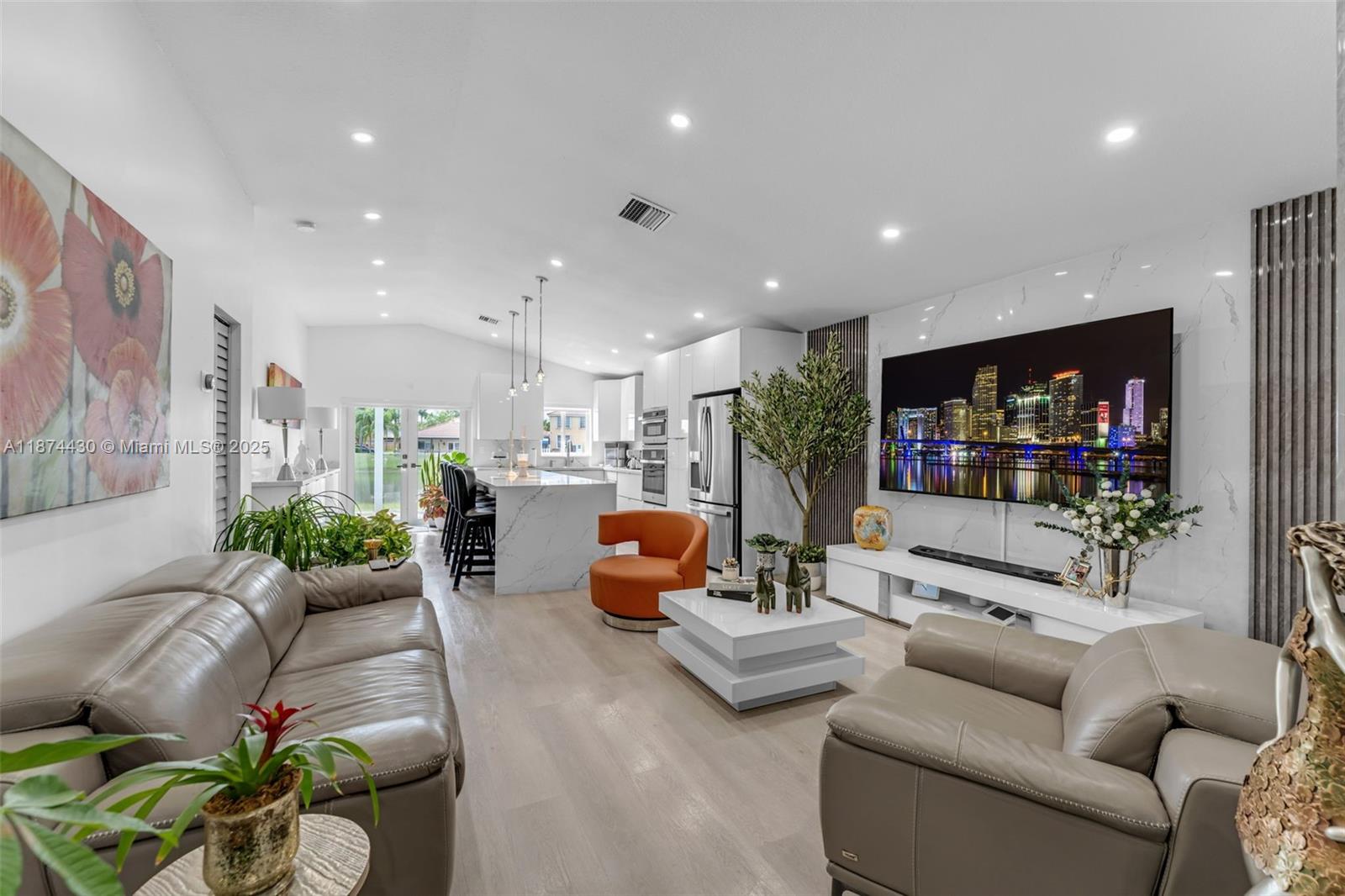 16300 Southwest 102nd Street Miami, FL 33196 - Photo 4 of 40 a living room with furniture and a flat screen tv