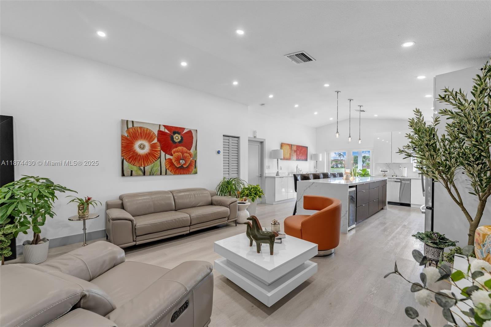 16300 Southwest 102nd Street Miami, FL 33196 - Photo 5 of 40 a living room with furniture kitchen view and a potted plant