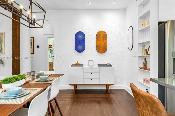 a kitchen with stainless steel appliances a stove a sink and a large window