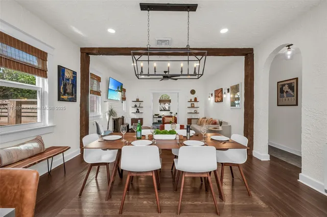 a bedroom with a bed and a view of kitchen