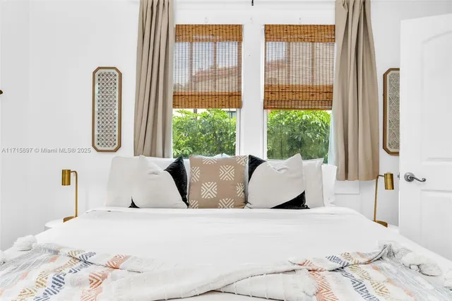 a view of a chair and table in the backyard