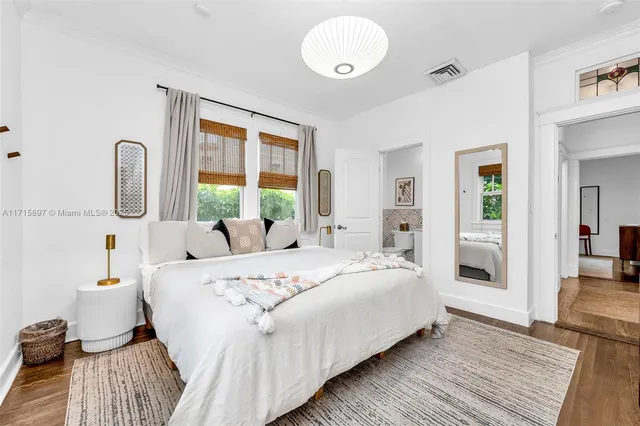 a view of a patio with a table and chairs under an umbrella