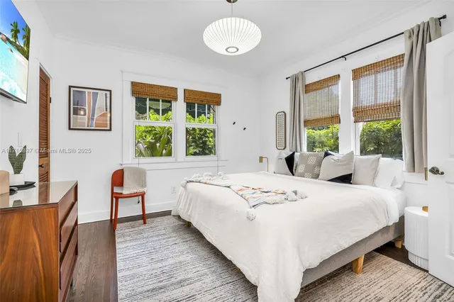 an aerial view of a house with a yard and garden