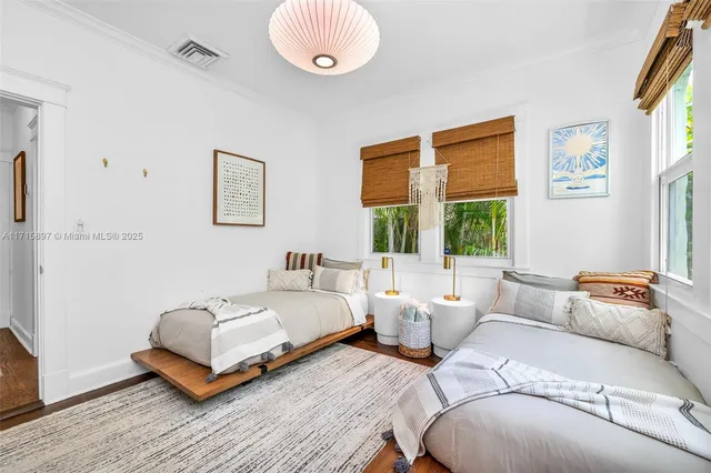 an aerial view of a house with a yard and garden