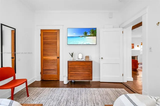 an aerial view of residential houses with outdoor space and trees