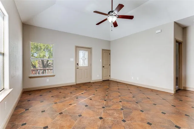 a view of an empty room and window