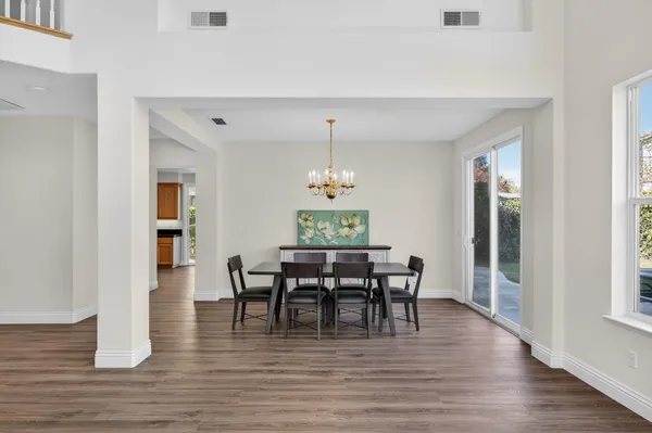 a view of a dining room with furniture window and wooden floor