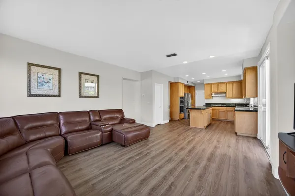 a view of kitchen with furniture and wooden floor