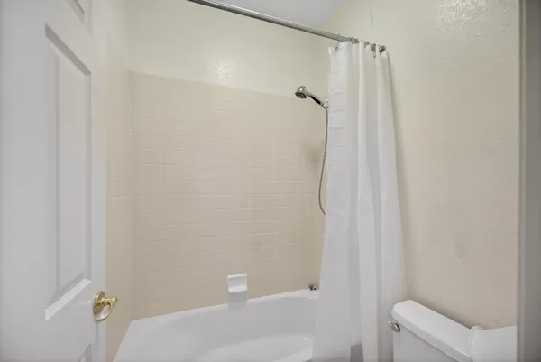 a view of a house with backyard porch and sitting area