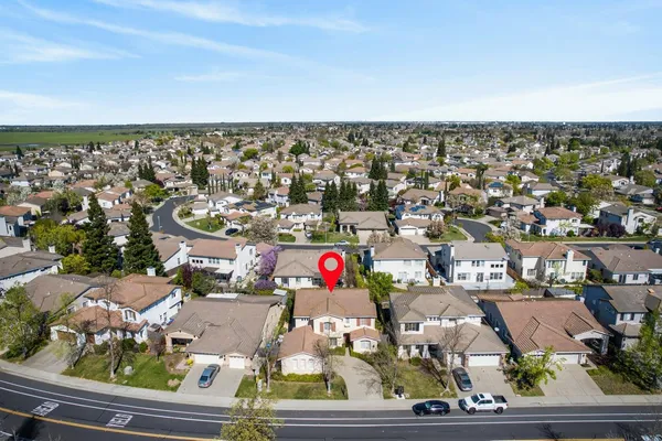 a view of swimming pool with a patio and a yard