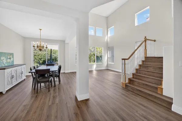 a view of a dining room with furniture window and wooden floor