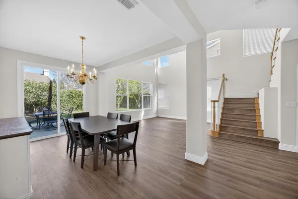 a view of a dining room with furniture window and wooden floor