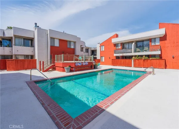 swimming pool view with a outdoor seating