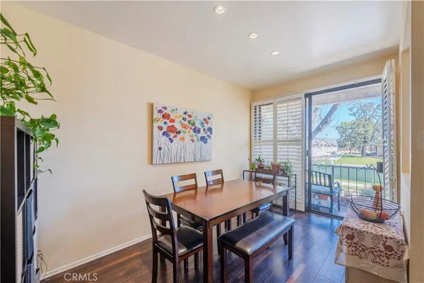 a view of a dining room with furniture window and wooden floor