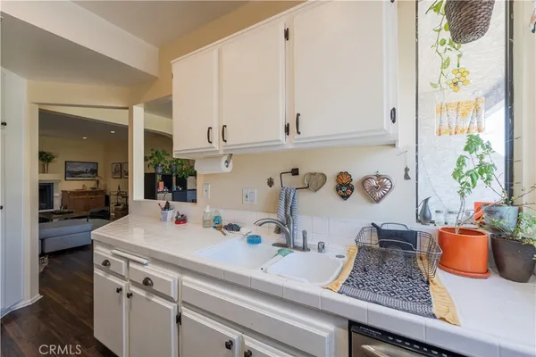 a kitchen with a sink and cabinets