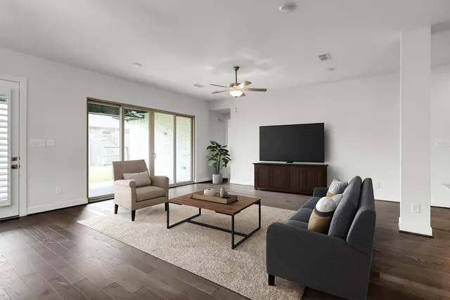 a view of a yard with porch and wooden fence