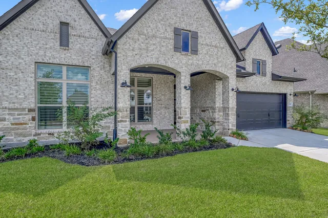 a front view of a house with a garage
