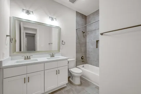 a view of a lake with houses in the back