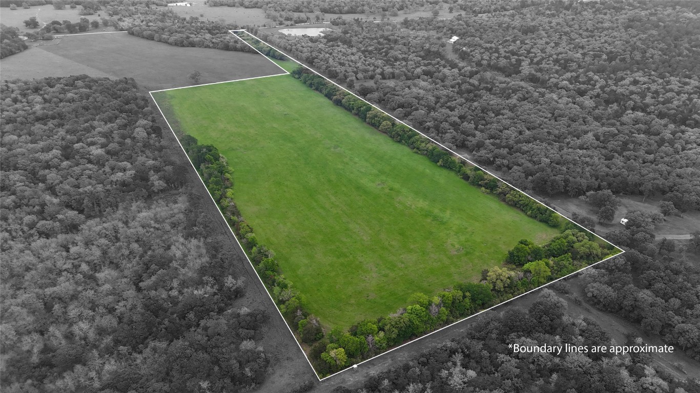 Tbd Tbd Street Paige, TX 78659 - Photo 14 of 14 Aerial view of sparsely populated area featuring a heavily wooded area and property boundaries highlighted