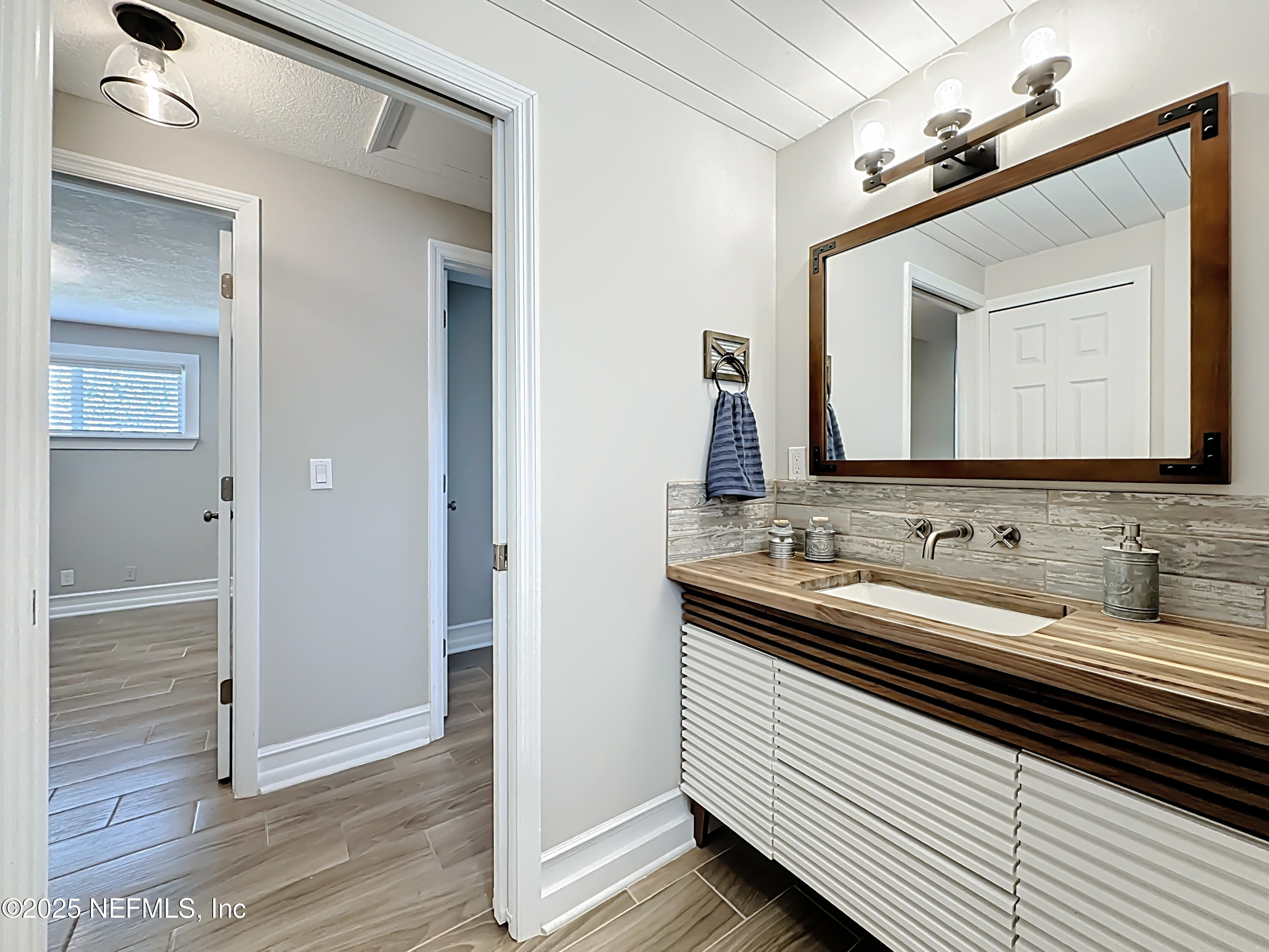 205 Noel Road Orange Park, FL 32073 - Photo 28 of 84 a bathroom with a double vanity sink and a mirror